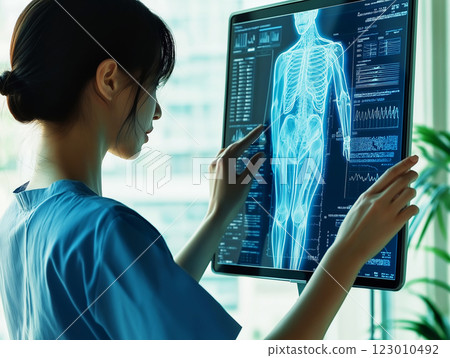 A medical professional examining a futuristic digital X-ray scan A medical professional examining a futuristic digital X-ray scan 123010492
