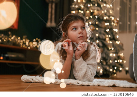 Portrait of little girl that is at home celebrating new year Portrait of little girl that is at home celebrating new year 123010646