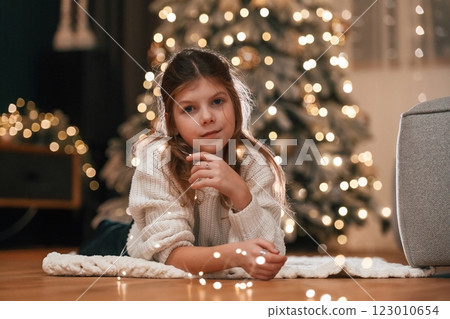 Portrait of little girl that is at home celebrating new year Portrait of little girl that is at home celebrating new year 123010654