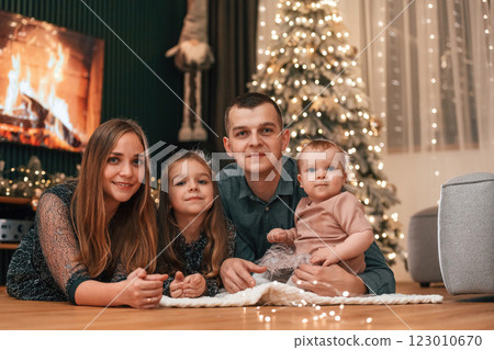 Happy family is sitting together at home. Celebrating New Year 123010670