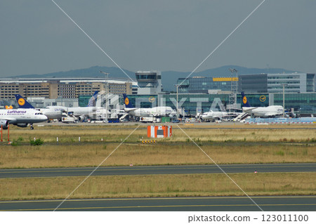 Frankfurt, Germany, July 9, 2017: Airport Apron with Terminal and Tower Frankfurt, Germany, July 9, 2017: Airport Apron with Terminal and Tower 123011100