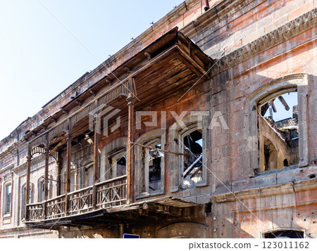 old wood balcony on destroyed house in Gyumri city 123011162