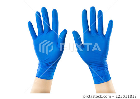 Two crossed hands in protective medical gloves with ope palms isolated at whitte background. 123011812