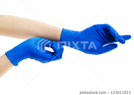 Doctor putting on protective gloves, isolated on white. Concept of coronavirus protection. 123011813