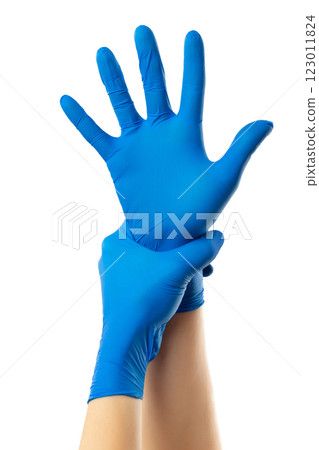 Doctor putting on protective medical gloves, isolated on white. Concept of coronavirus protection. Doctor putting on protective medical gloves, isolated on white. Concept of coronavirus protection. 123011824