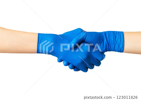 Handshake with blue medical gloves, profile view on white background. Prevention of coronavirus pandemic concept. 123011826