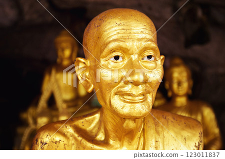 Closeup image of group of golden buddhism statues in Thailand. Closeup image of group of golden buddhism statues in Thailand. 123011837