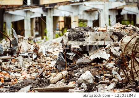 A closeup image of a garbage dump with ruined brick and wooden planks. Concept of disaster, war. 123011848