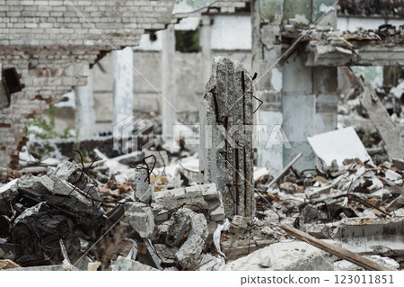 A closeup image of a ruined building with concrete and armature around. Concept of disaster, war. Retreat for homeless. 123011851