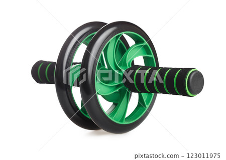 Closeup image o abdominal wheel isolated at white background. Home fitness fitness wheel. Healthy lifestyle at quarantine. Closeup image o abdominal wheel isolated at white background. Home fitness fitness wheel. Healthy lifestyle at quarantine. 123011975