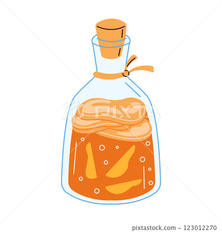 Fermented kombucha in a glass flask with ginger pieces 123012270