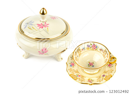 Vintage porcelain candy bowl ,cup and saucer isolated on white. Collage. Free space for text. Vintage porcelain candy bowl ,cup and saucer isolated on white. Collage. Free space for text. 123012492