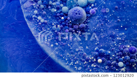 Multicolored emulsion. Oil bubbles. Blue violet liquid texture mixing with gel drops. Paint smooth wave abstract art water background. 123012920