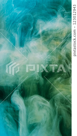 Color smoke. Abstract background. Blur green blue paint water explosion fume flow floating golden shimmering glitter particles art texture. 123012943