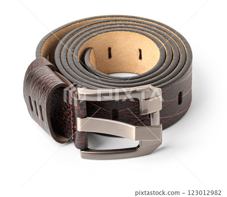 Brown leather belt with metal buckle rolled up on white background 123012982