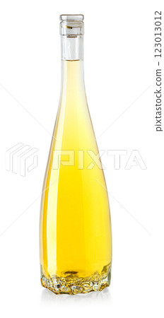 Full glass bottle of white wine on white background reflecting light 123013012