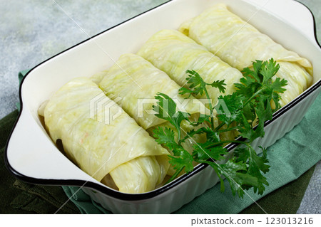 raw cabbage rolls, not cooked, with minced meat, top view, without people, in the spotlight. 123013216
