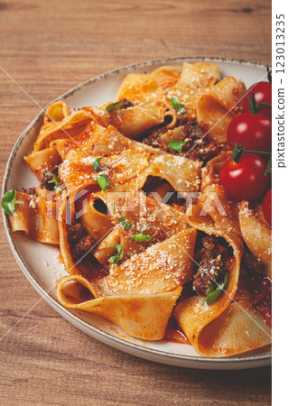 pappardelle pasta with bolognese sauce, topped with parmesan cheese and cherry branch, homemade, no people, pappardelle pasta with bolognese sauce, topped with parmesan cheese and cherry branch, homemade, no people, 123013235
