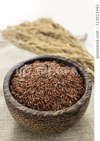 unhulled asian red rice grains in rustic setting display in Cambodia unhulled asian red rice grains in rustic setting display in Cambodia 123013342