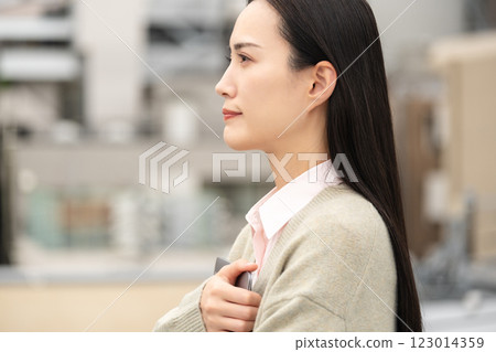 Image of a city, a computer and a businesswoman 123014359