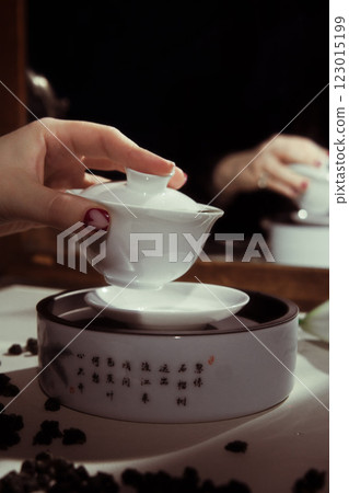 An Elegant Tea Ceremony Featuring a Beautiful Fine Porcelain Teapot and Cup Perfectly Presented An Elegant Tea Ceremony Featuring a Beautiful Fine Porcelain Teapot and Cup Perfectly Presented 123015199