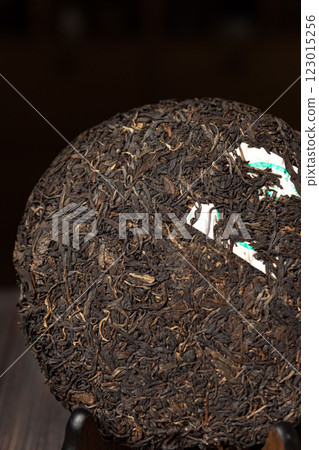 This is a CloseUp of a Compressed Tea Cake showcasing its intricate details and textures This is a CloseUp of a Compressed Tea Cake showcasing its intricate details and textures 123015256