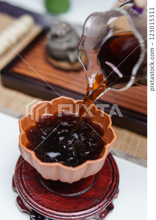 Pouring Tea in the Traditional Tea Ceremony is a calming practice uniting nature and art 123015311