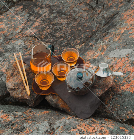 A serene tea setup on a rugged surface, creating an inviting atmosphere for relaxation 123015323