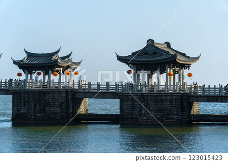 A Serene Traditional Pavilion Gracefully Over Water Amidst Natures Beauty and Calmness A Serene Traditional Pavilion Gracefully Over Water Amidst Natures Beauty and Calmness 123015423
