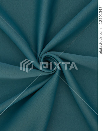 Close-up of twisted sea green curtain fabric texture in smooth folds 123015484