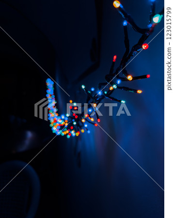 Colorful String Lights Illuminate a Dark Hallway Creating a Festive Atmosphere at Night 123015799