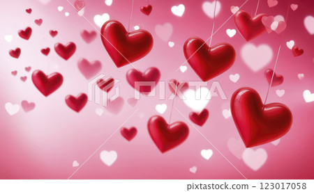 Red Hearts Floating Against a Soft Pink Background Create a Romantic Atmosphere for Celebrations 123017058