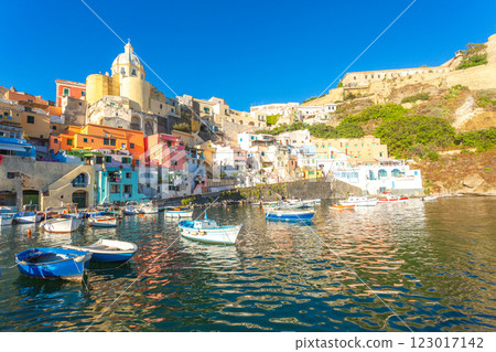 Procida harbor, colorful buildings, boats moored. 123017142