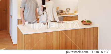 Couple drinking coffee in the kitchen in the morning 123018987