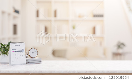 A desk with decorative items and empty space for display products, set in a minimalist living room. A desk with decorative items and empty space for display products, set in a minimalist living room. 123019964