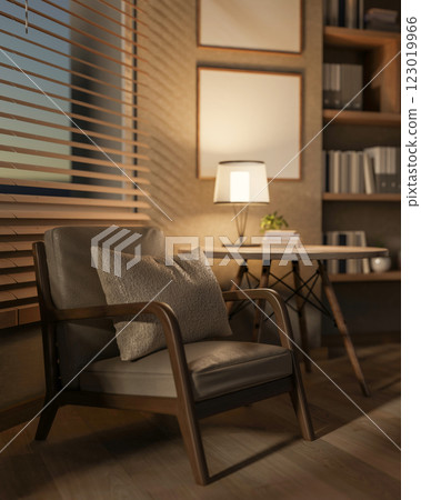 A minimalist armchair and table sit in a cozy contemporary room, illuminated by a lamp on the table. 123019966
