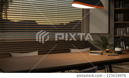 A minimalist hardwood dining or meeting table by the window in a contemporary room. 123019976