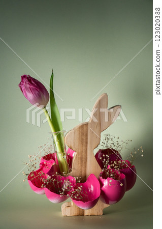 Creative vibrant handmade Easter table decoration with egg shells wooden bunny on pastel green background copy space. Greeting card idea Easter home tradition Seasonal sustainable Creative vibrant handmade Easter table decoration with egg shells wooden bunny on pastel green background copy space. Greeting card idea Easter home tradition Seasonal sustainable 123020388