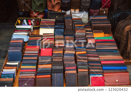 handmade leather wallets, belts and accessories on counter at a street market in Vietnam in Asia handmade leather wallets, belts and accessories on counter at a street market in Vietnam in Asia 123020432