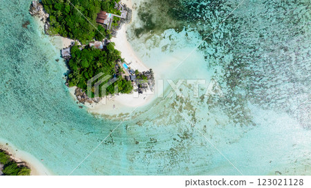 Small island with lush vegetation, white sand beaches, and clear waters. Seychelles, Mahe. Small island with lush vegetation, white sand beaches, and clear waters. Seychelles, Mahe. 123021128
