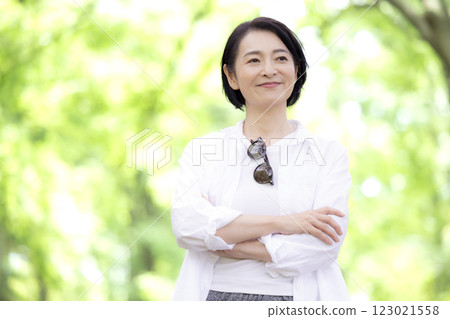 Middle-aged woman walking in the park Middle-aged woman walking in the park 123021558