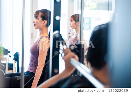 Person training on a machine at the gym Person training on a machine at the gym 123022089