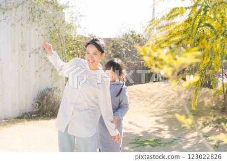 Two women playing in the garden 123022826