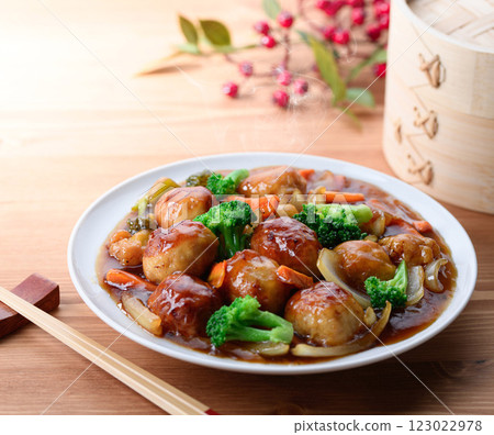 Plenty of vegetables and meatballs in sweet and sour sauce 123022978