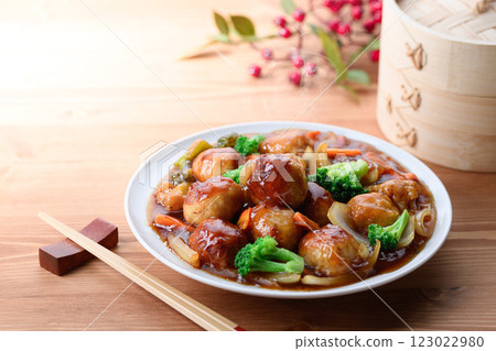 Plenty of vegetables and meatballs in sweet and sour sauce 123022980