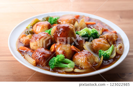 Plenty of vegetables and meatballs in sweet and sour sauce 123022985