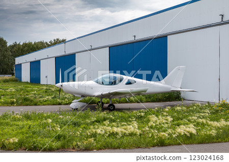 White small sports airplane at the aviation hangars 123024168