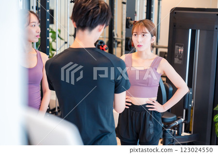 Gym trainer and student Gym trainer and student 123024550