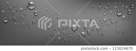 Water droplets scatter on smooth gray surface. 123024670