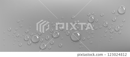 Water droplets scatter on smooth gray surface. 123024812